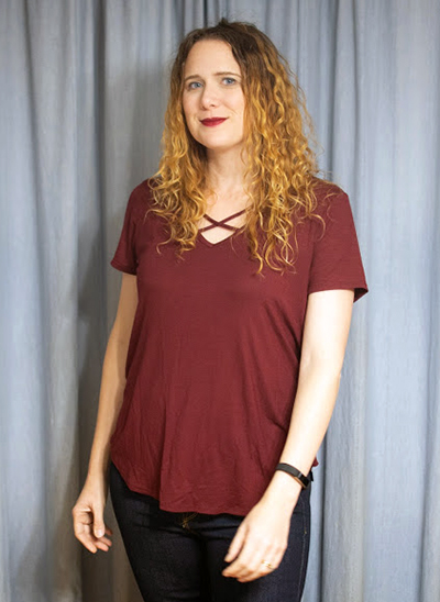 A wine-colored tee with a cut-out detailing at the neck