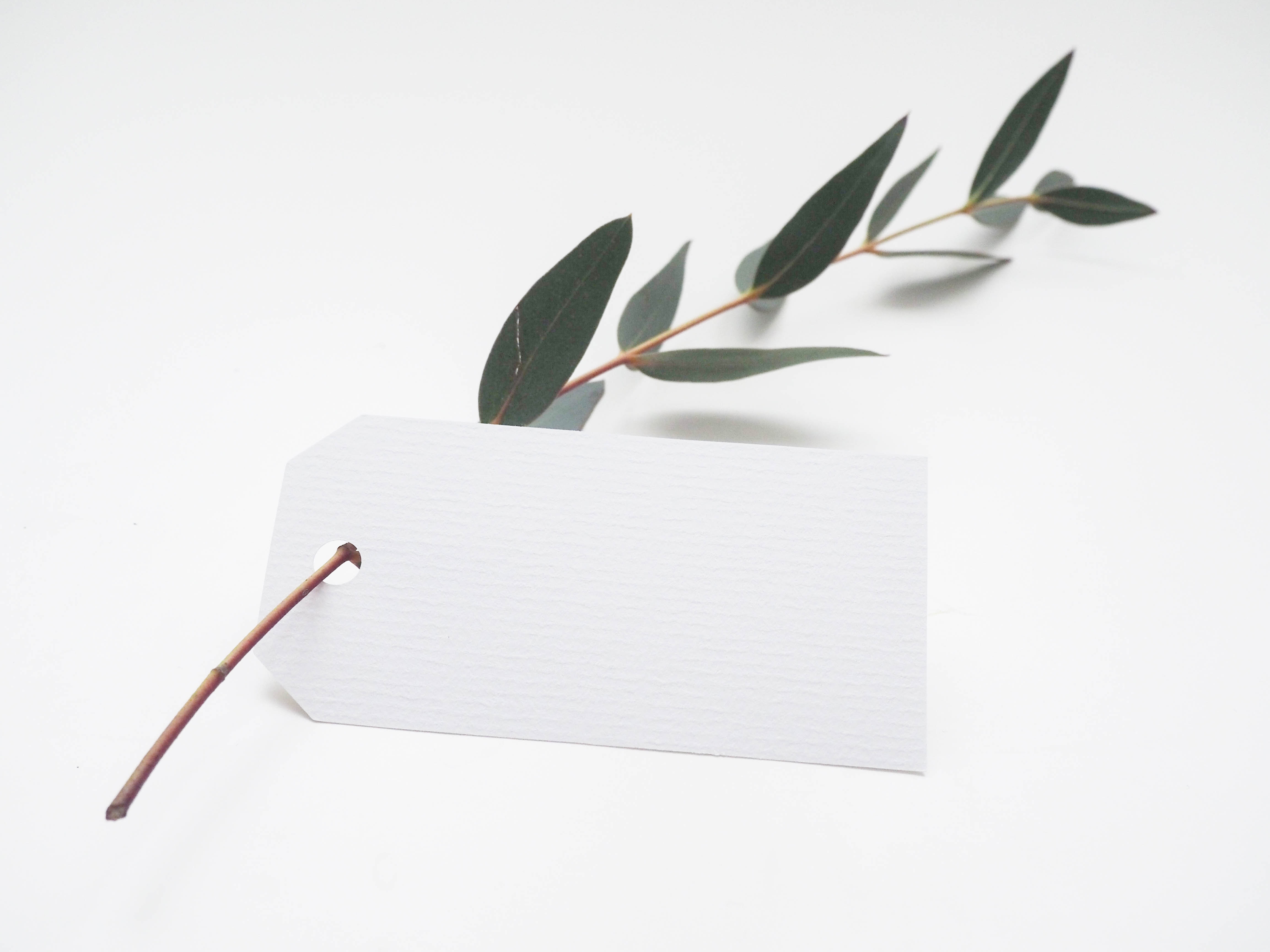 A paper tag with greenery