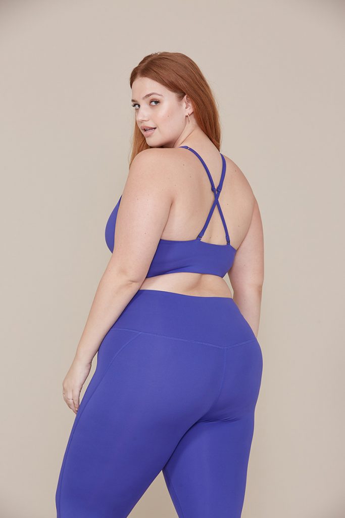 A woman modeling athletic wear from Girlfriend Collective. 