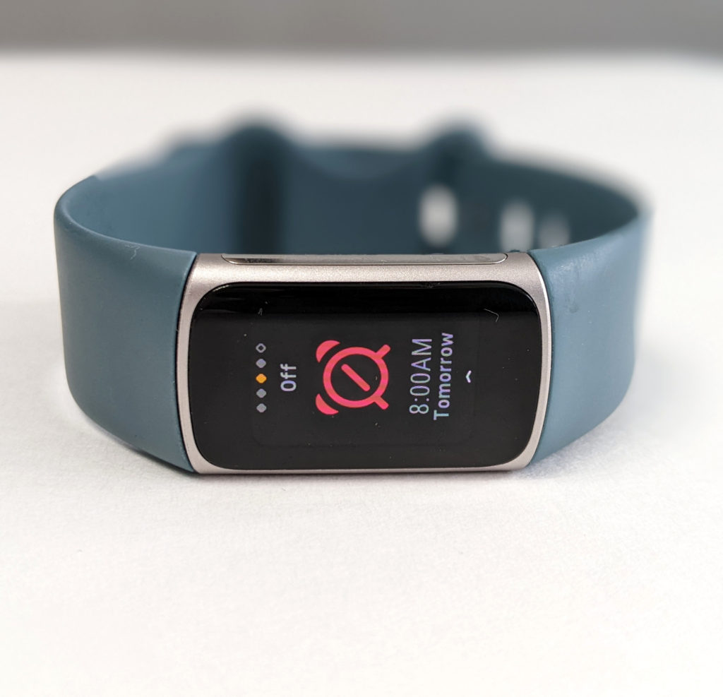 A screen on a Fitbit Charge 5 showing an alarm setting